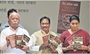 RSS chief Mohan Bhagwat (left) releases books on Dalits written by BJP spokesman Vijay Sonkar Shastri (middle) in New Delhi on Sunday. HRD Minister Smriti Irani is also seen. Photo: R.V. Moorthy